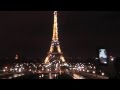 Shining at night Eiffel Tower. Сверкающая ночью Эйфелева башня