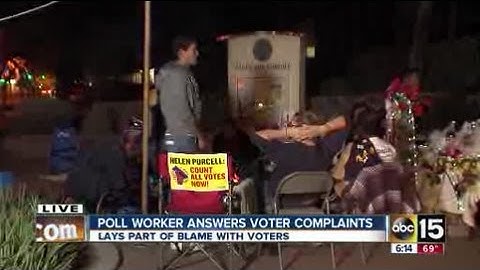 Poll worker answers voter complaints
