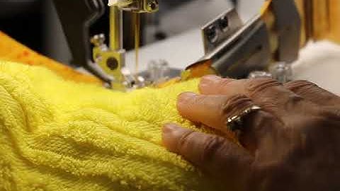 Hooded bath towel with PFAFF binder accessory with Paula on PFAFF Performance Icon