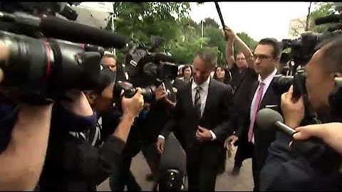 Nigel Wright arrives at court and makes way through crush of media