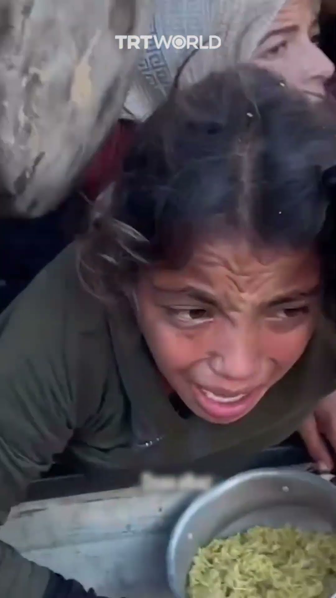 Crowd crushes displaced Palestinian children as they seek food