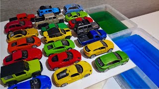 Colourful cars crashing into colourful water