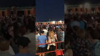 Matt Schultz of Cage tElephant climbs on the roof of Riversbend Wealth