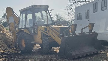 JCB 3cx pushing muck