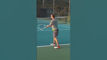 Two handed backhand contact point