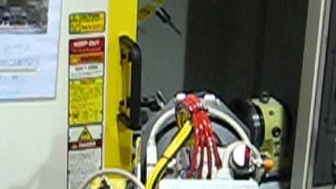 Meredith Machinery - Syncronized Robots  Loading Conveyor 2