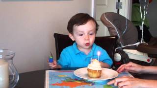 Mitchell blows out his birthday candles - 2 years old