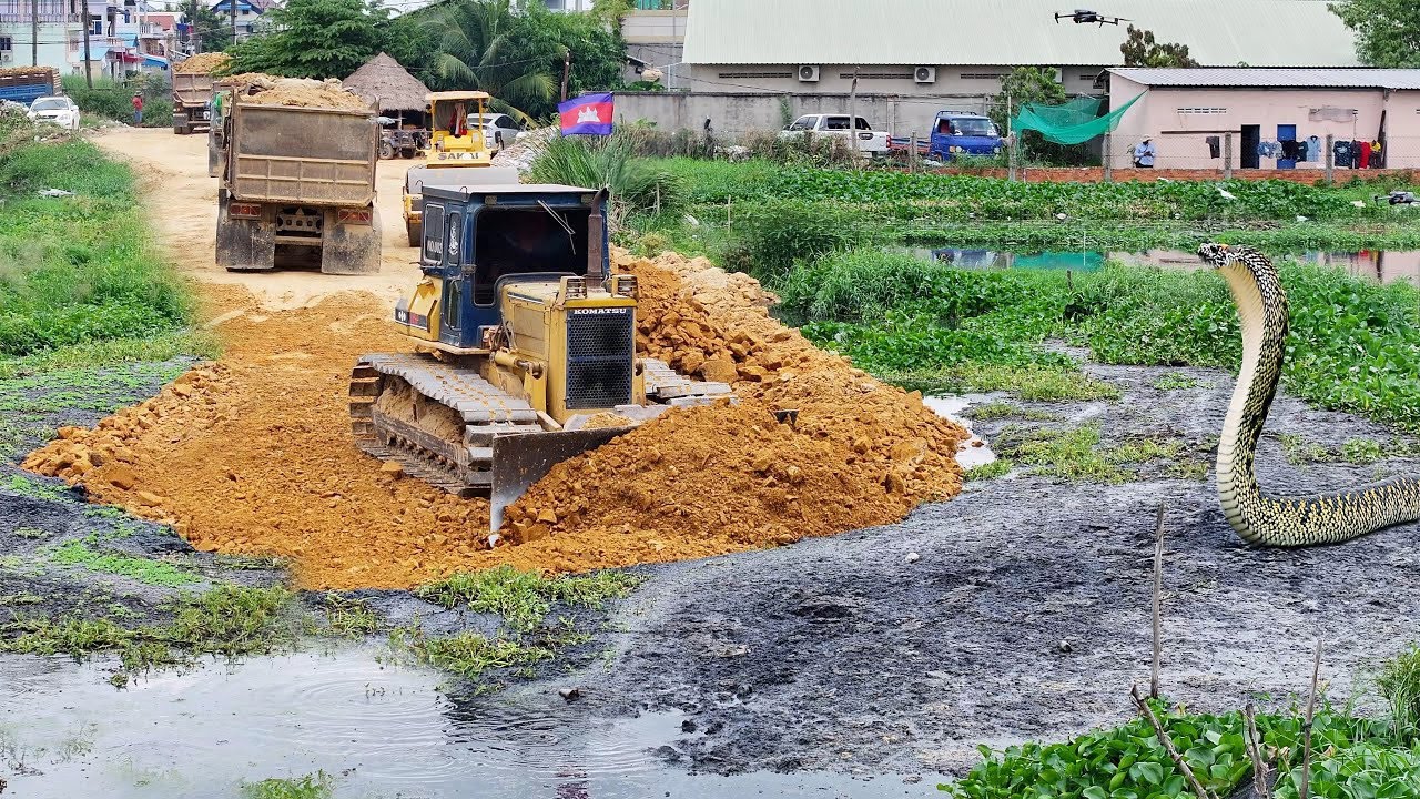 Unique project: Komatsu D-41-P & D31-A bulldozers collaborate to build new road along canal