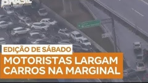 Motoristas deixam carros em pontos alagados da Marginal Tietê após chuva que atingiu SP