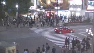 Looking out from the starbucks over shibuya crossing in tokyo japan, i
saw a nice red ferrari 458 italia!