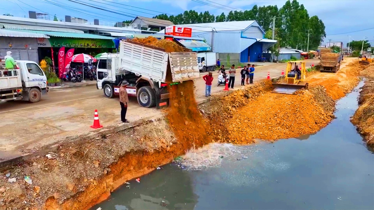 Dump Truck and Bulldozer Working Together Pond Filling Project Massive ...