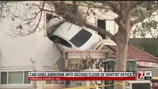 Car goes airborne into second floor of dentist office