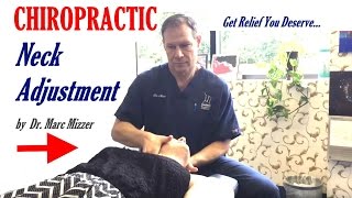 Chiropractic neck adjustment by Dr. Marc Mizzer - Chiropractor in Columbia Maryland