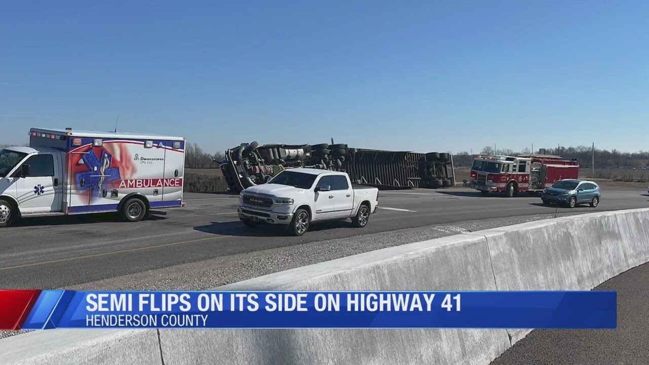 Semi flips on its side on Highway 41 - YouTube
