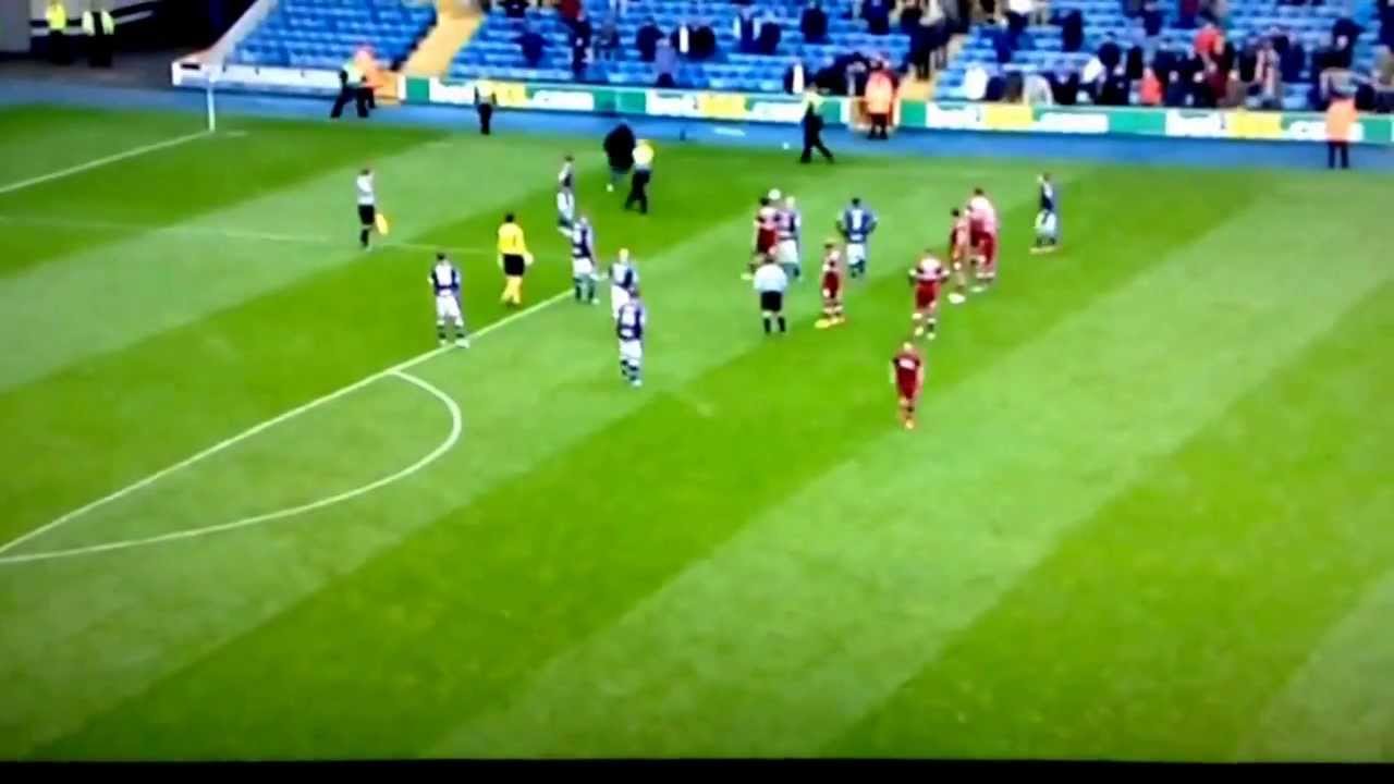 Millwall fans runs on pitch against Derby.
