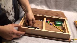 Art box that looks like a wooden book, that can hold 24 pencils storage area, and build in pencil sharpener.