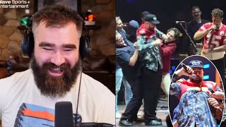 Jason Kelce reacts as Paul Rudd hilariously struggles to help Travis Kelce don a Chiefs jersey