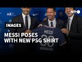 Football: Lionel Messi poses with new PSG shirt | AFP