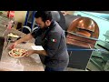 Making pizza with the Izzo Pizza oven