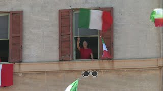 Romans fly flags and sing 'Bella Ciao' from windows to mark Liberation Day | AFP