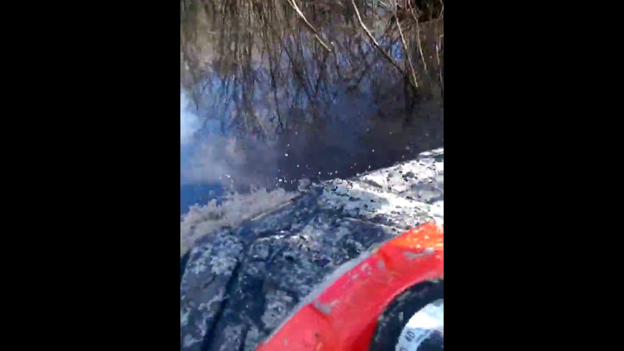 Flooded trail on a Sportsman 570 2 wheel drive. GSE Exhaust. YouTube