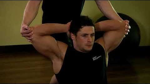 Behind Head Chest Stretch   Exercise Videos & Guides   Bodybuilding com