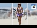 🌍Kimberley Garner shows off her incredible figure in skimpy purple bikini and a matching skirt as