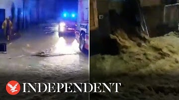 Torrent of water rushes down road as Tuscany hit by heavy floods