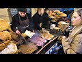 Street Food in Poland. Huge Load of Tasty Food on Roasted Bread. Christmas Market, Krakow