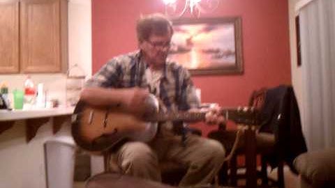 Jim Connor Banjo Man playing Guitar