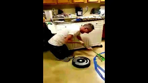 Curling with Roomba and short person.