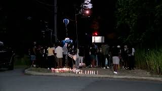 Spring Valley residents hold candlelight vigil in honor of slain 17-year-old high school athlete