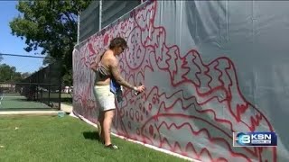Colorado muralist creates 20‑foot piece at Salina’s Smoky Hill River Festival