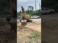 Clamping Timber: Mini Excavator Clears Mud From Unpaved Training Grounds