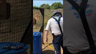 Picking up a pistol from a flat surface in competition shooting idpa uspsa shorts shootingrange