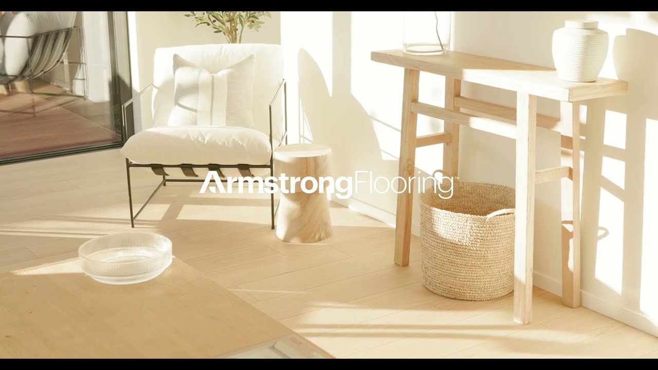Armstrong Queenstown laminate flooring laid through a sunlit living room