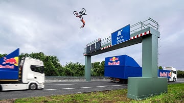 World First! Motorbike Flip Between Two Moving Trucks