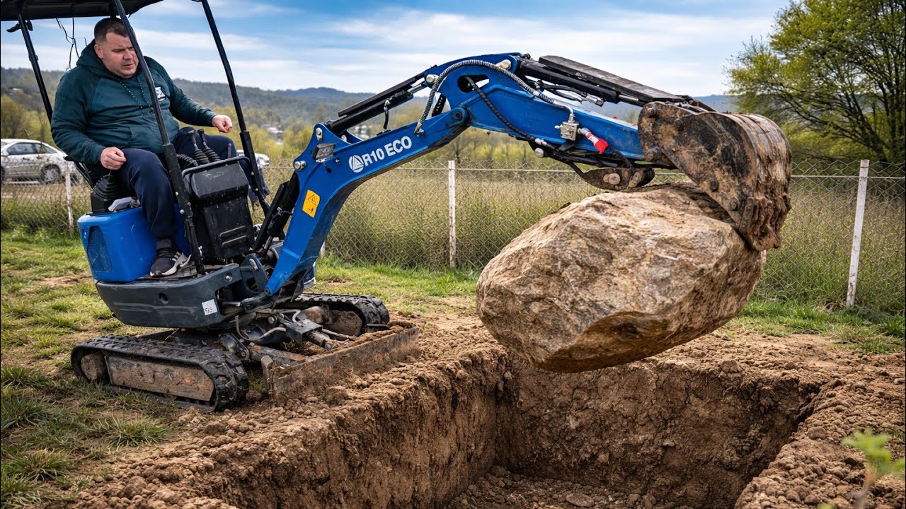 Mini Excavator Pulls Out a MASSIVE Rock from the Lawn