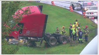 Man taken to hospital with life-threatening injuries after crash pins car under semi cab