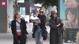 Chrissy Teigen holds her son Miles on errand run with her mother