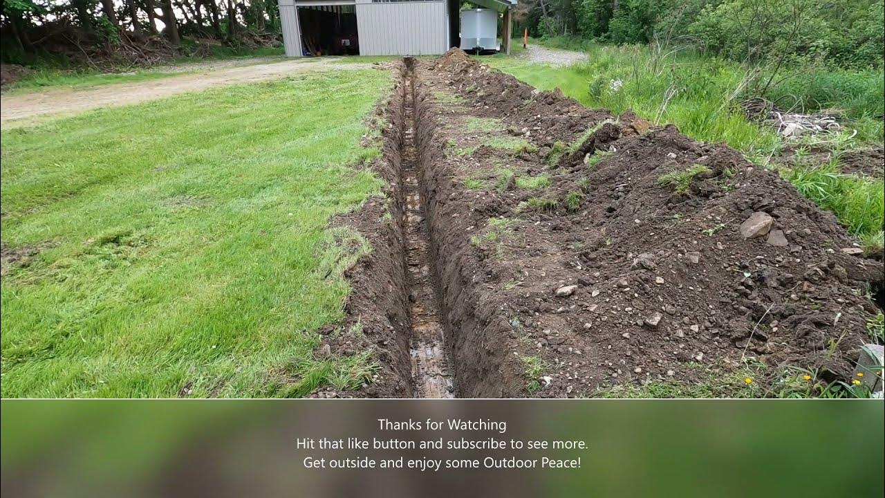 Bobcat E35 Excavator 12" bucket digging ditch for new electric service