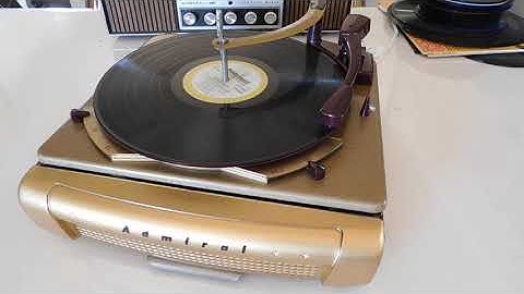 Vintage ADMIRAL 3 speed automatic record changer playing a couple LP