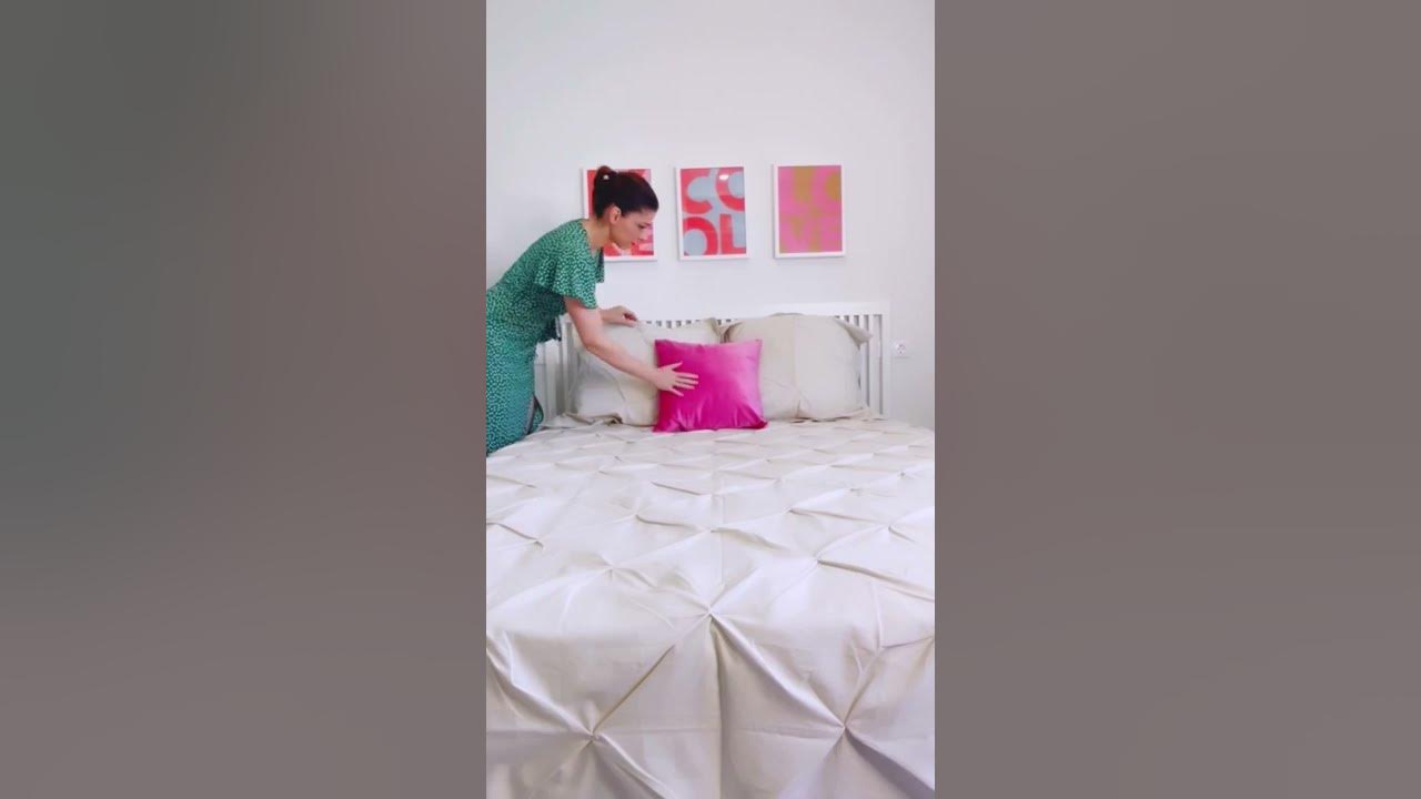 Cómo decorar una cama: cojines y mantas