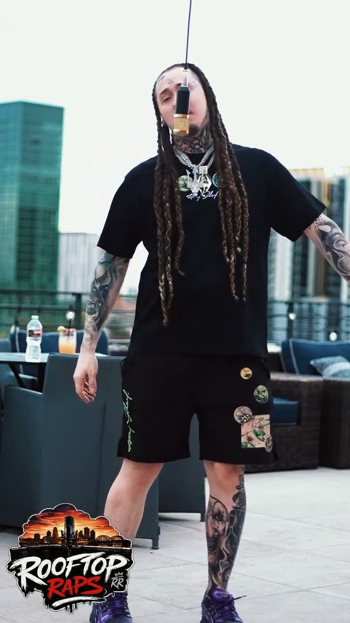 Rooftop Raps performing under the hanging mic on a rooftop
