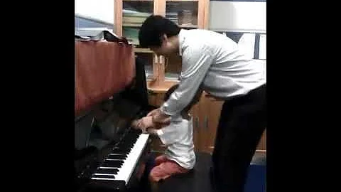 Miguel Playing Piano with A. Junta