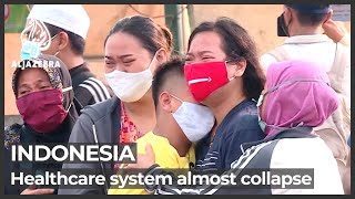As COVID emergency measures start, Indonesians ‘crying for help’