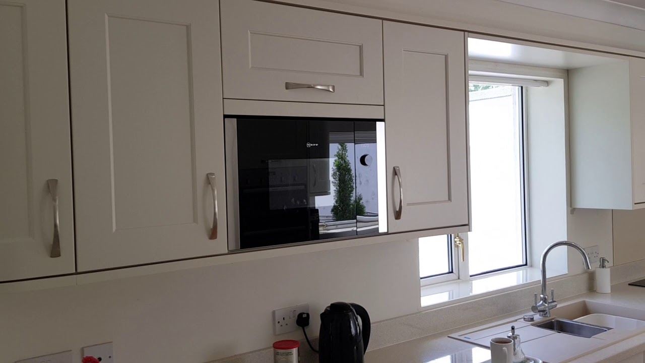 Gloss laminate ivory shaker kitchen