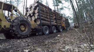LOADED log truck getting pushed out!