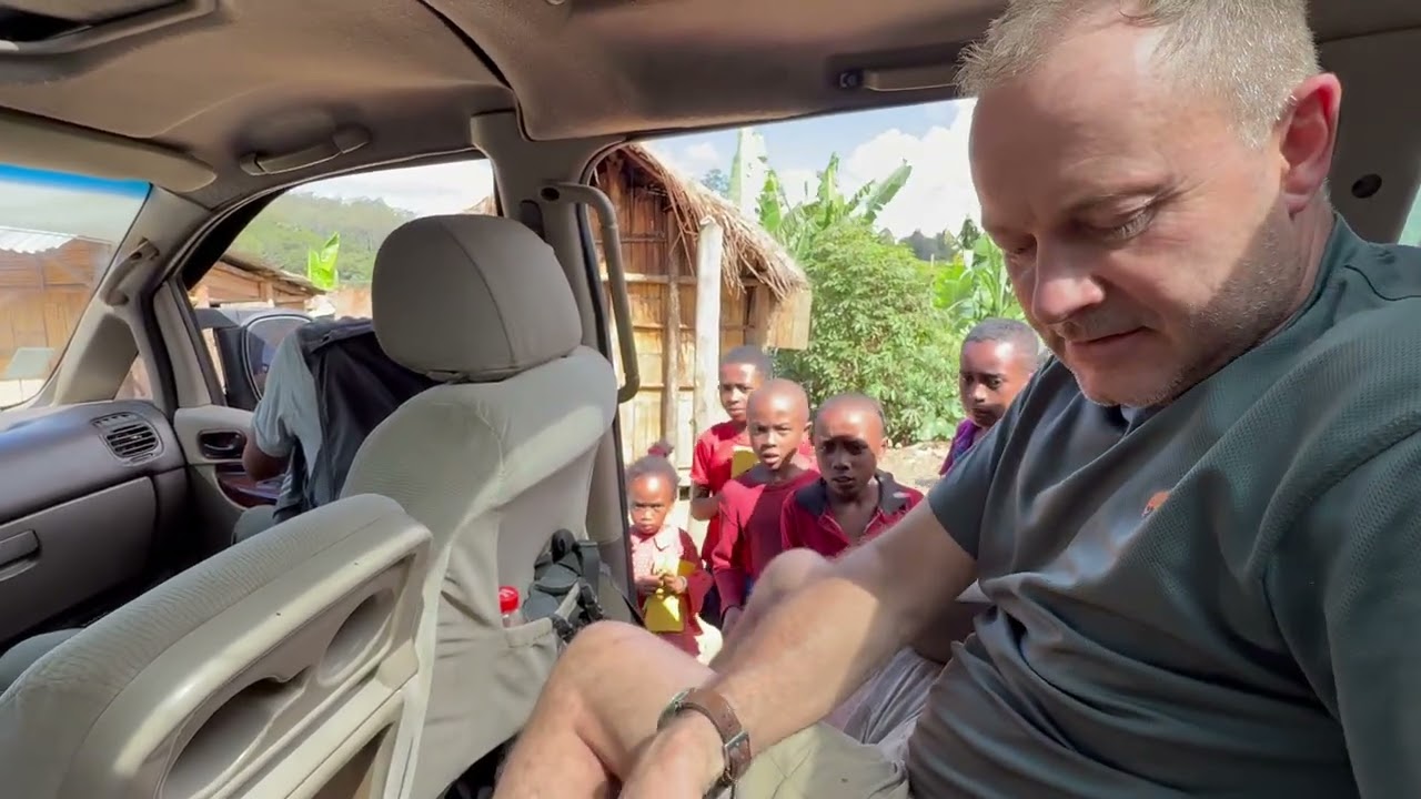 Madagascar: Mantadia NP - giving books & pencils to children :-)