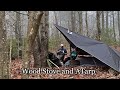 Tarp camping with a wood stove  in the clouds with no tent